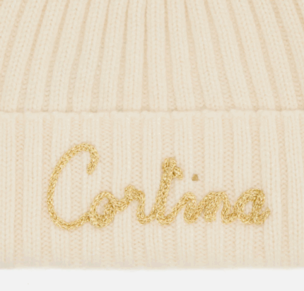 Berretto Wengen W F con pompon bianco